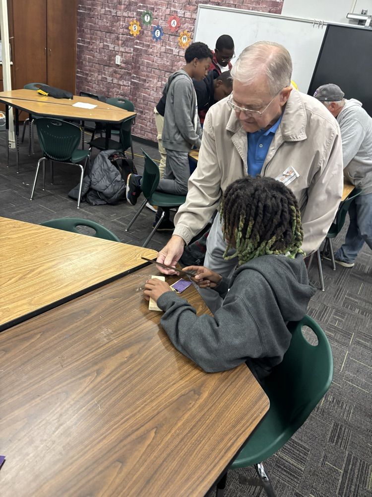 students working on pine box race cars 