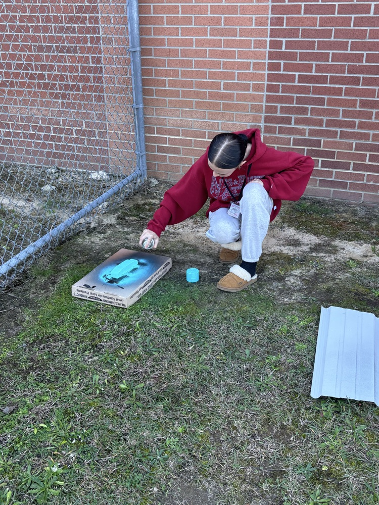students painting pine box race cars 
