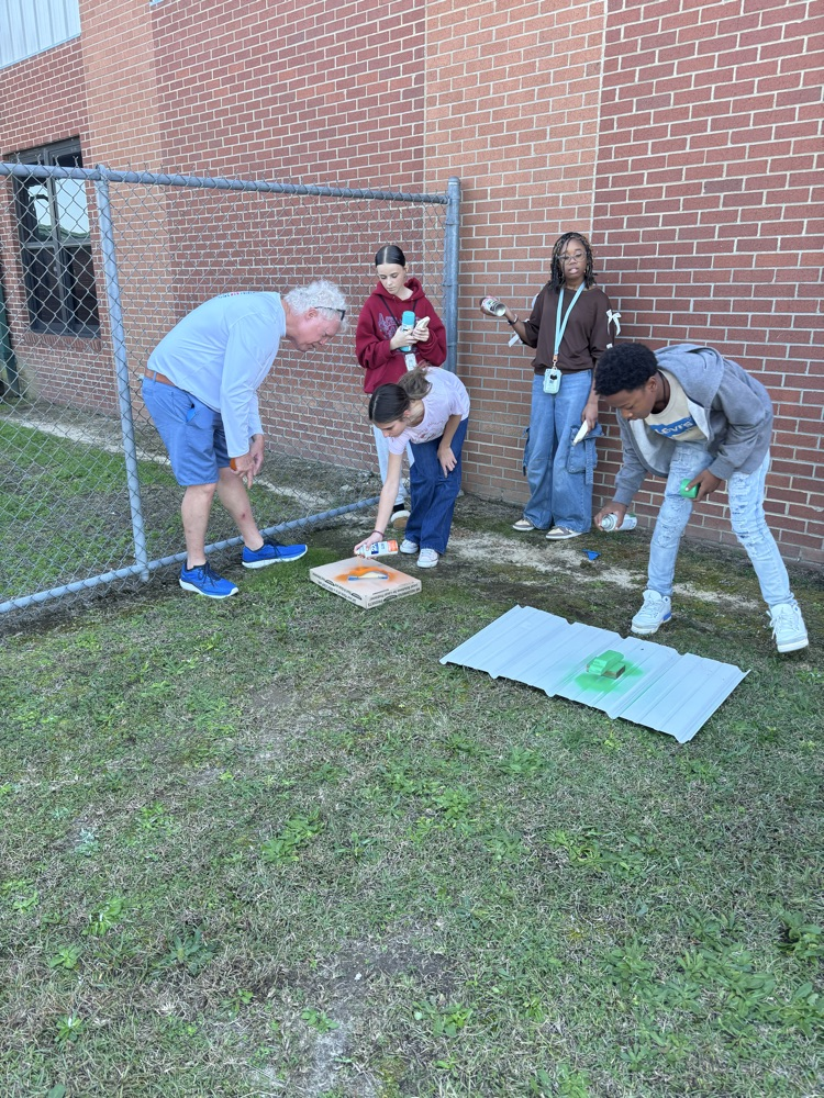 students painting pine box race cars 