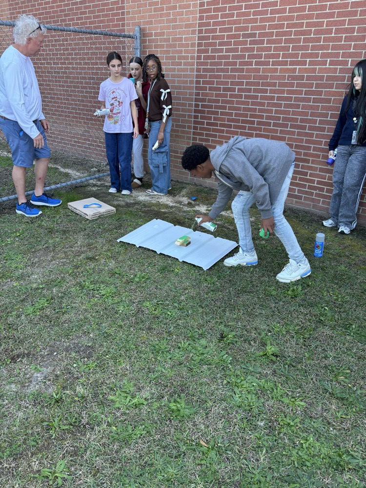 students painting pine box race cars 
