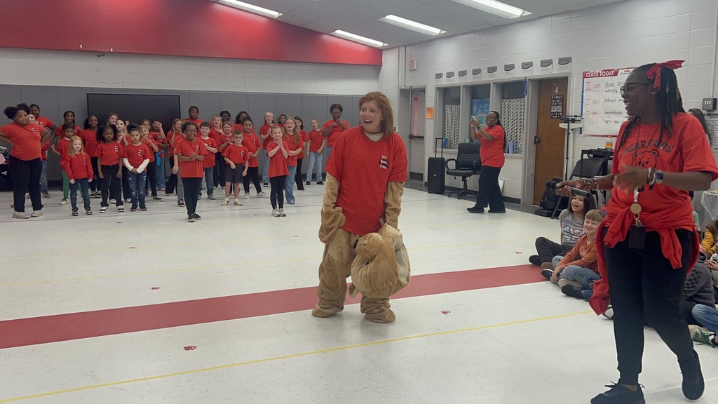 Prinicipal dressed as mascot without bear head.