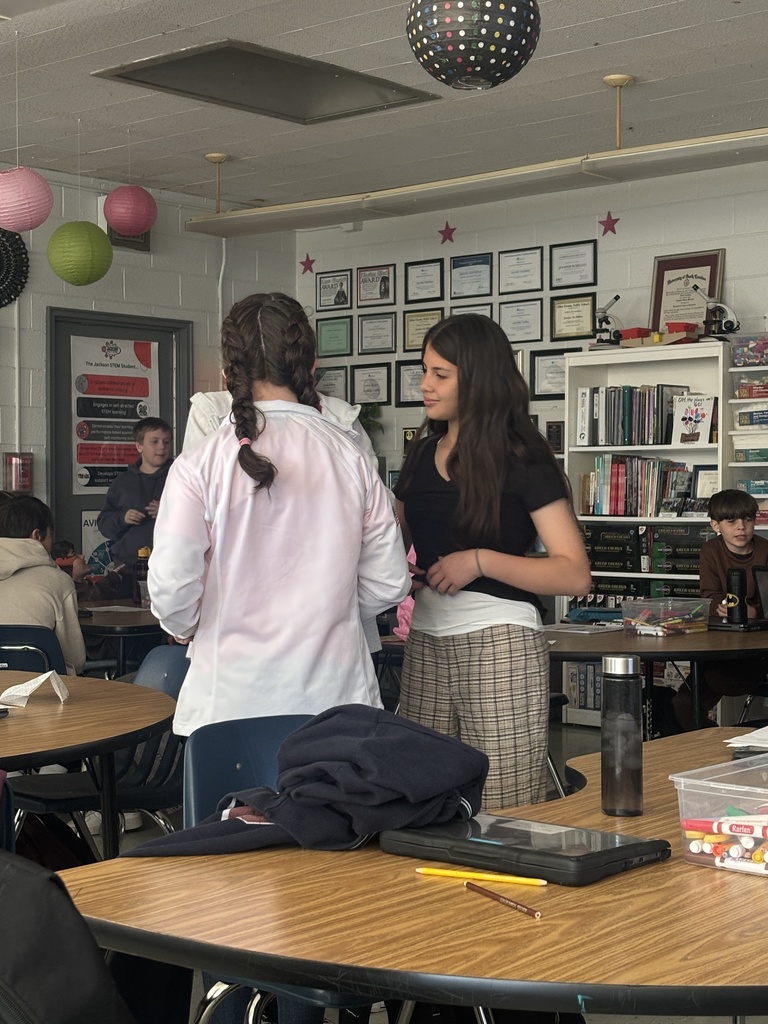 Students role playing during SEL activity.