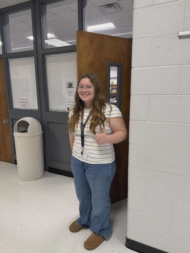 Key Club member greeting faculty and staff at the door