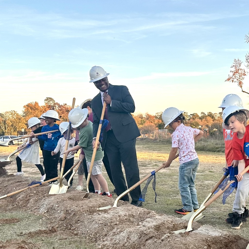 Superintendent, Dr. Corey Murphy, breaking ground with students at a groundbreaking