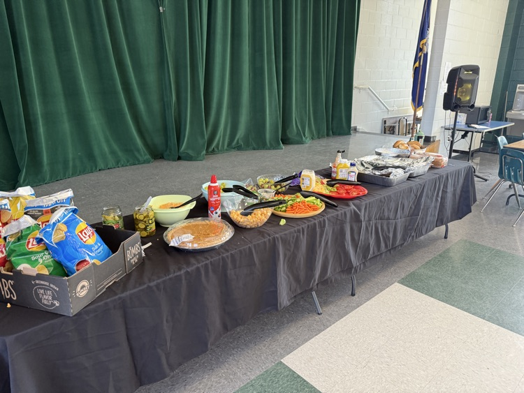 student posing with Thanksgiving lunch tray 