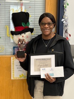 Picture of a lady holding a trophy