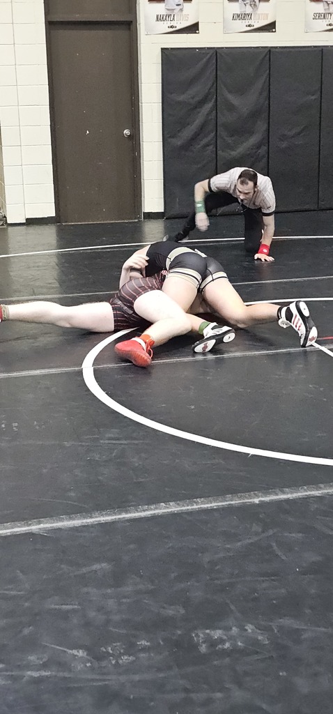 Male wrestlers in competition.