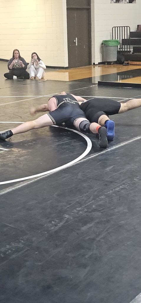 Male wrestlers in competition.