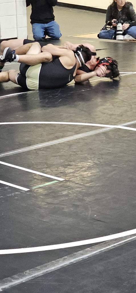 Male wrestlers in competition.