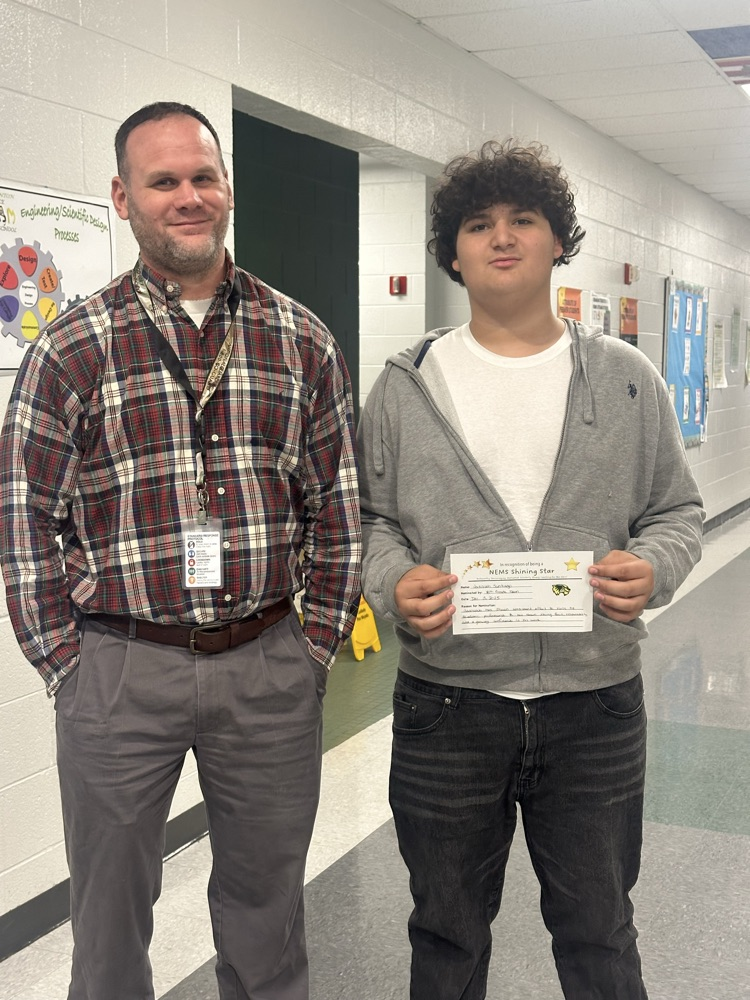 student posing with certificate 