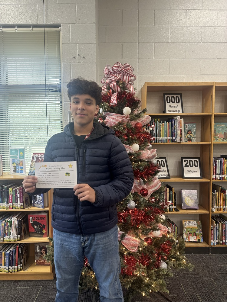 student posing with certificate 