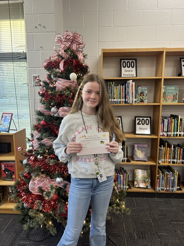 student posing with certificate 