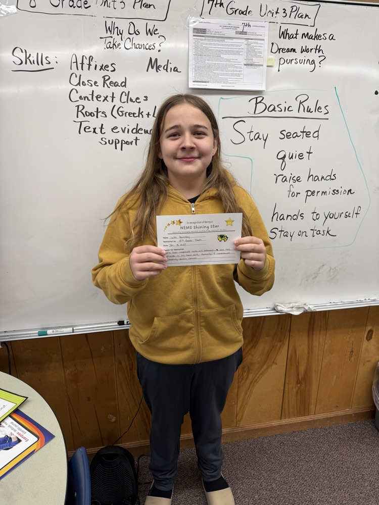 student posing with certificate 