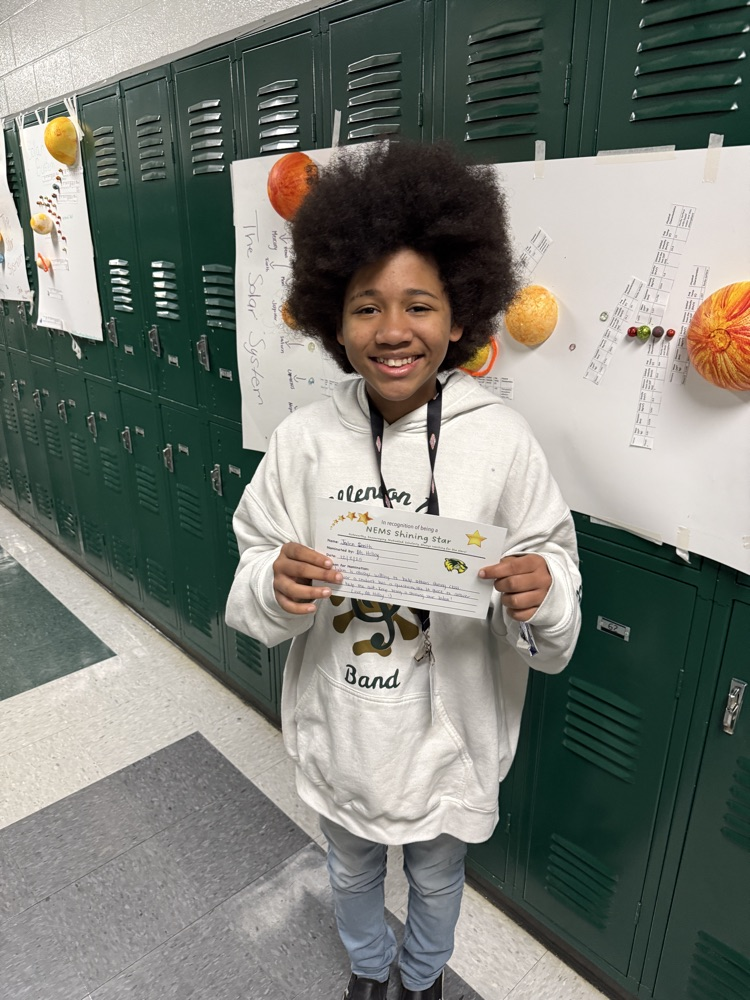 student posing with certificate 