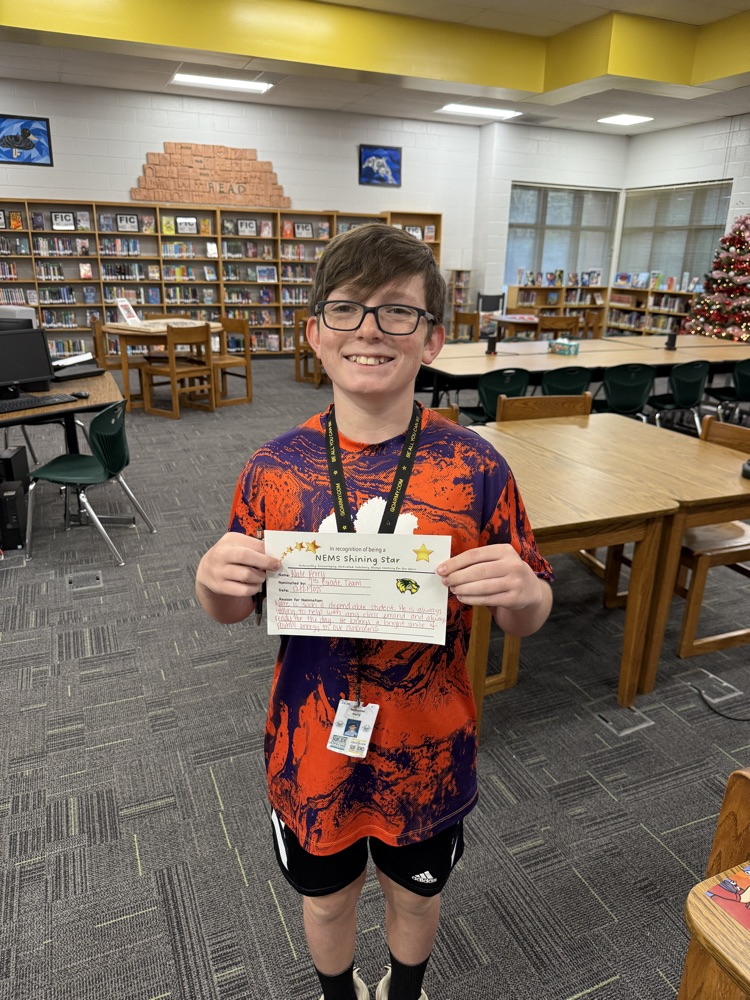 student posing with certificate 