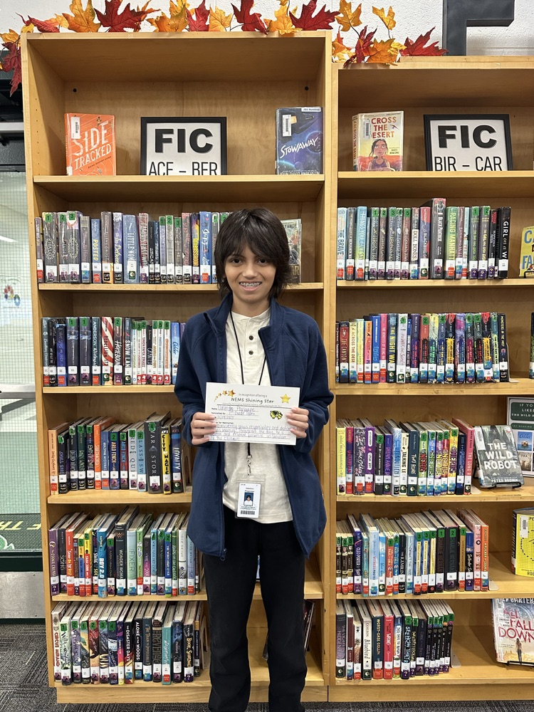 student posing with certificate 