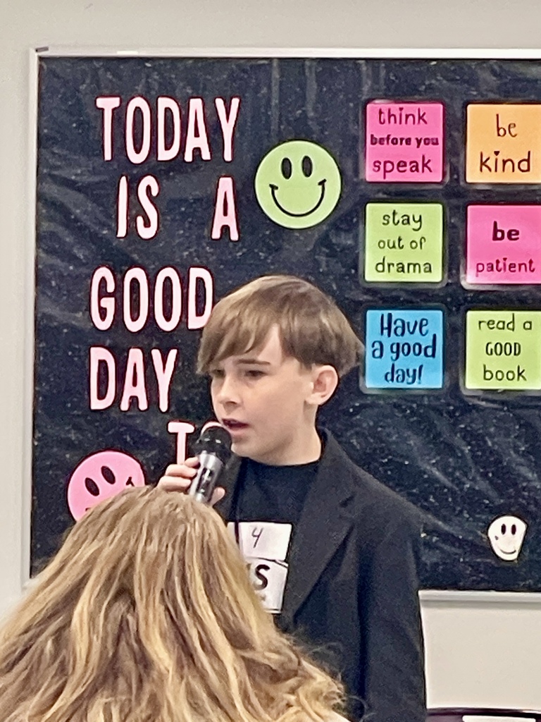 Carter Little spelling a word.