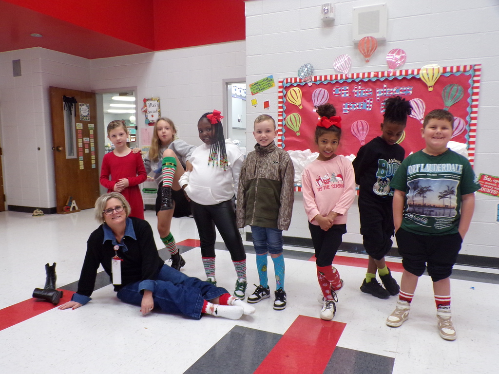 Students and staff wearing holiday socks.