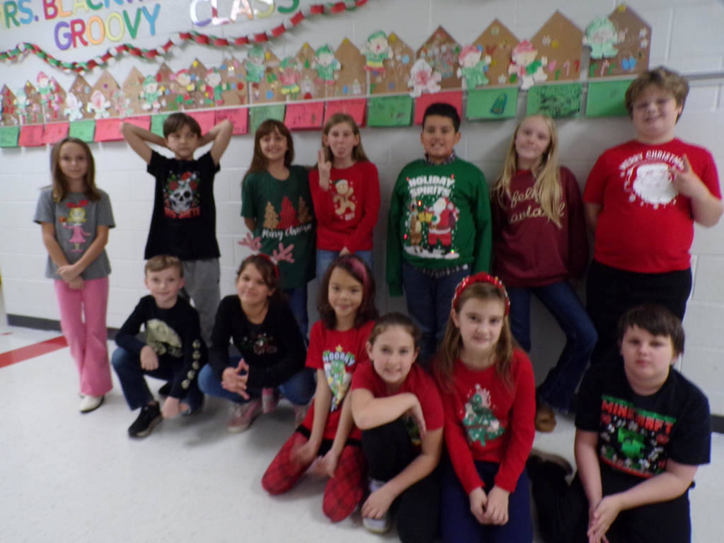 STudents wearing holiday shirts.