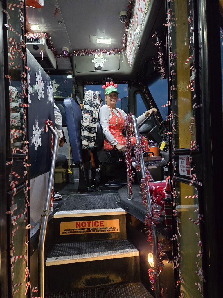 Bus driver of Chrstmas decorated bus.