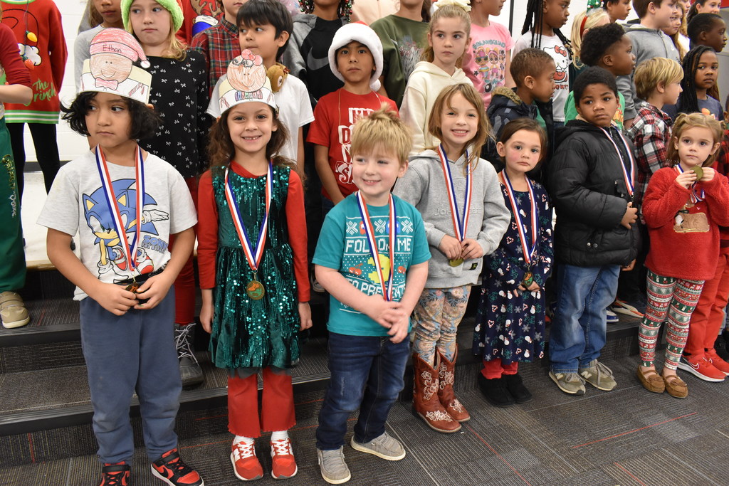 Runners with medals.