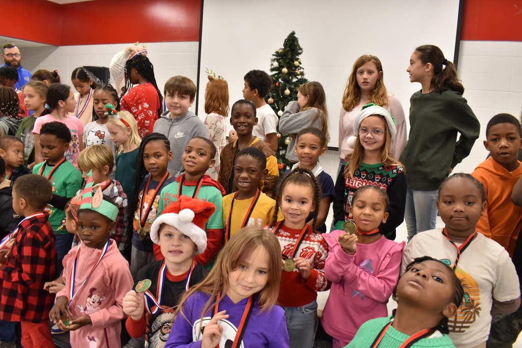 Runners with medals.