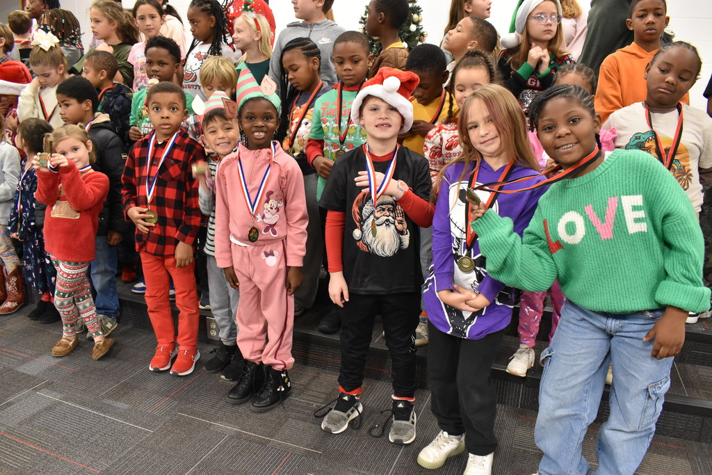 Runners with medals.