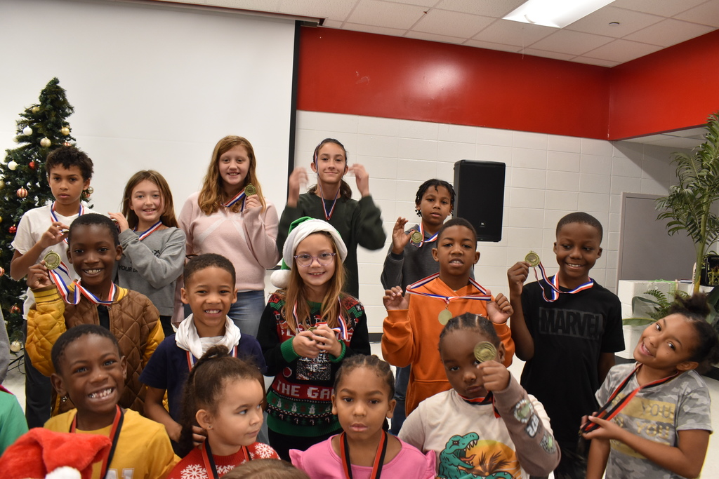 Runners with medals.