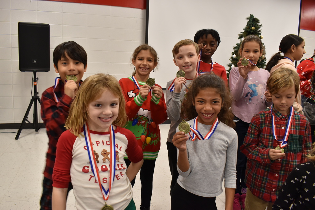 Runners with medals.