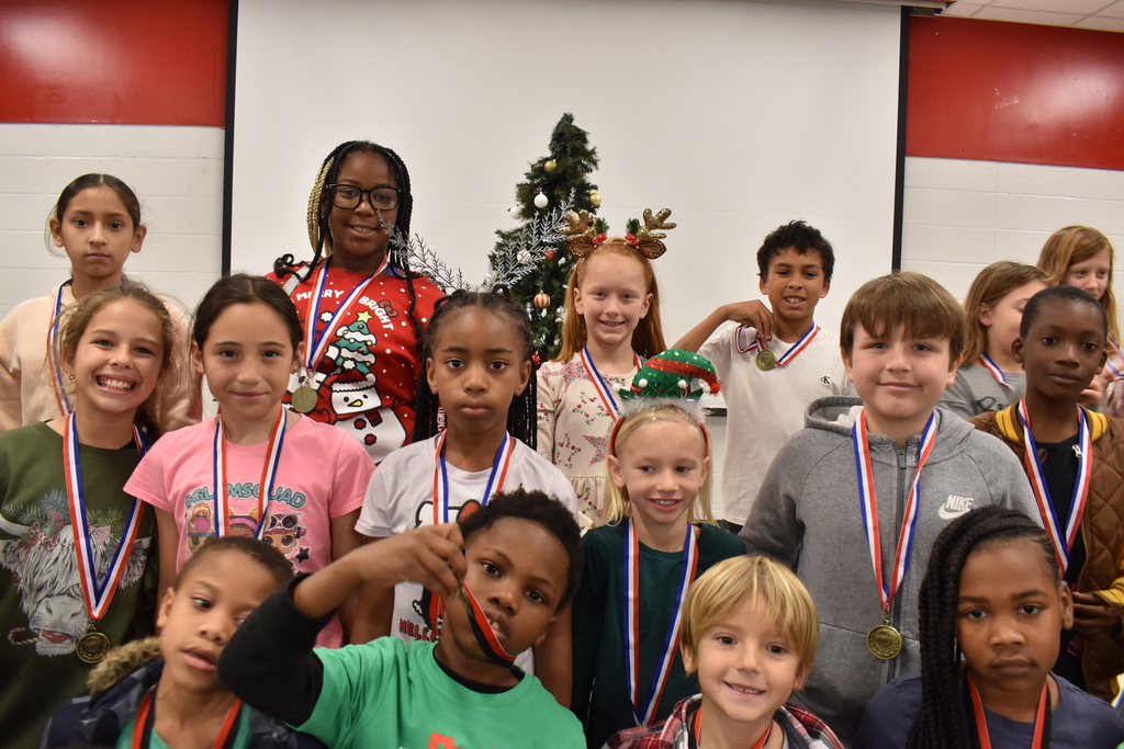 Runners with medals.