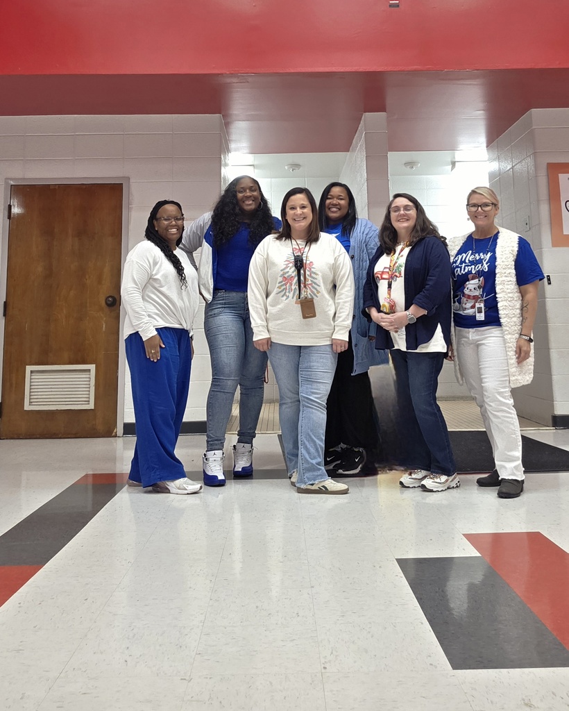 Staff dressed in blue and white.