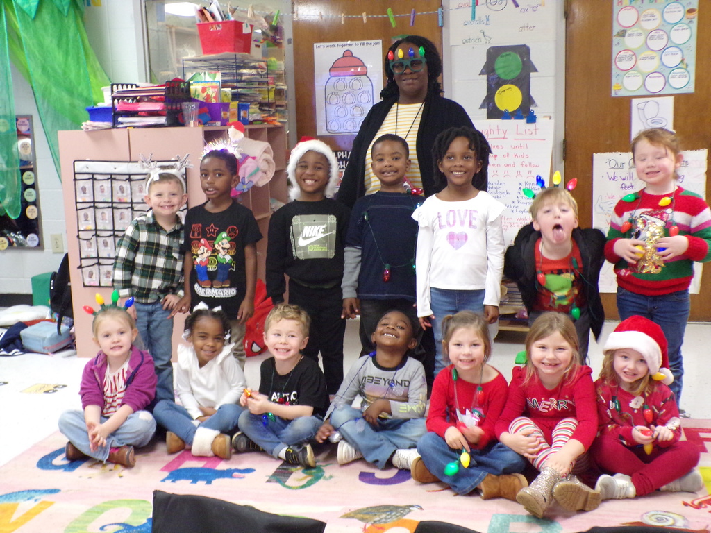 Students and staff dressed in Christmas attire.