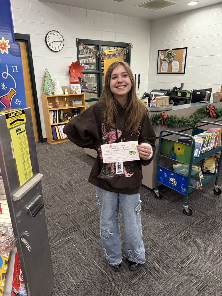students holding a certificate and smiling 