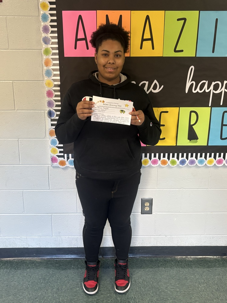 students holding a certificate and smiling 
