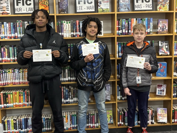 students holding a certificate and smiling 