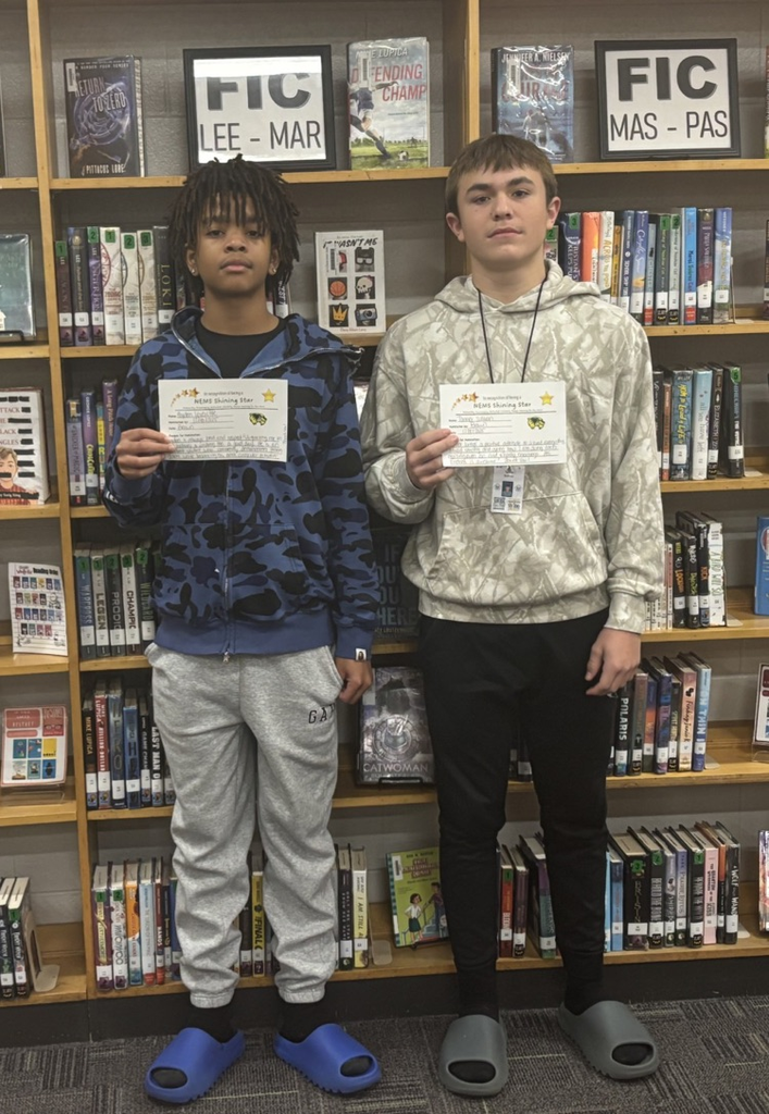 students holding a certificate and smiling 