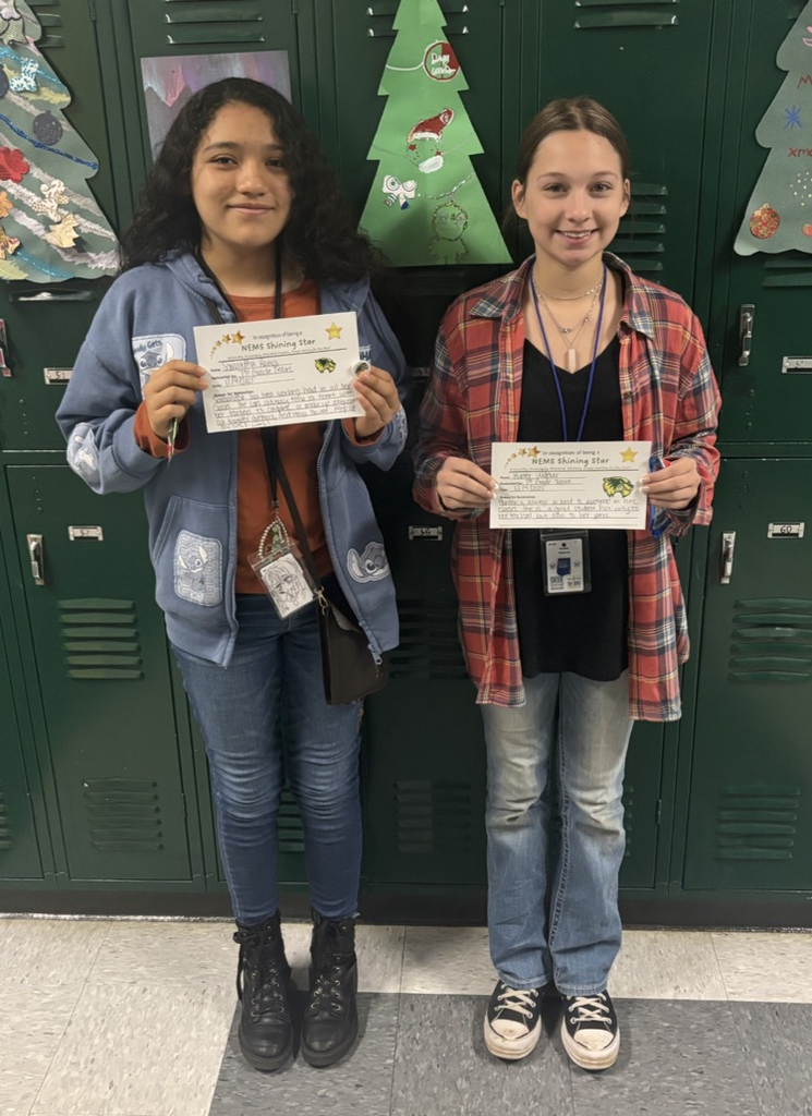 students holding a certificate and smiling 