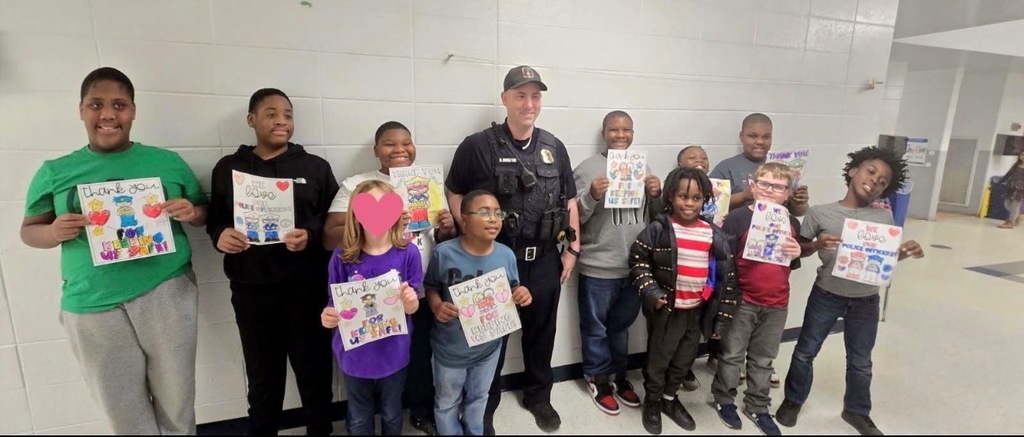 Students showing appreciation to Officer Moulton