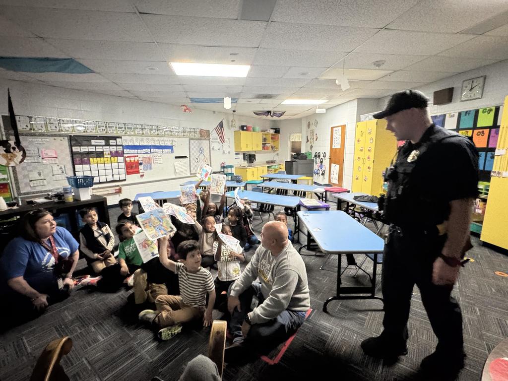 Students showing appreciation to Officer Moulton