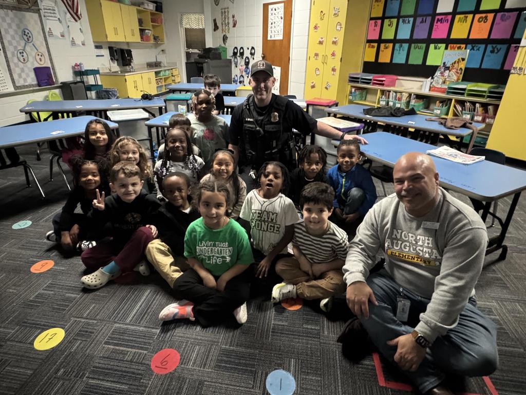 Students showing appreciation to Officer Moulton