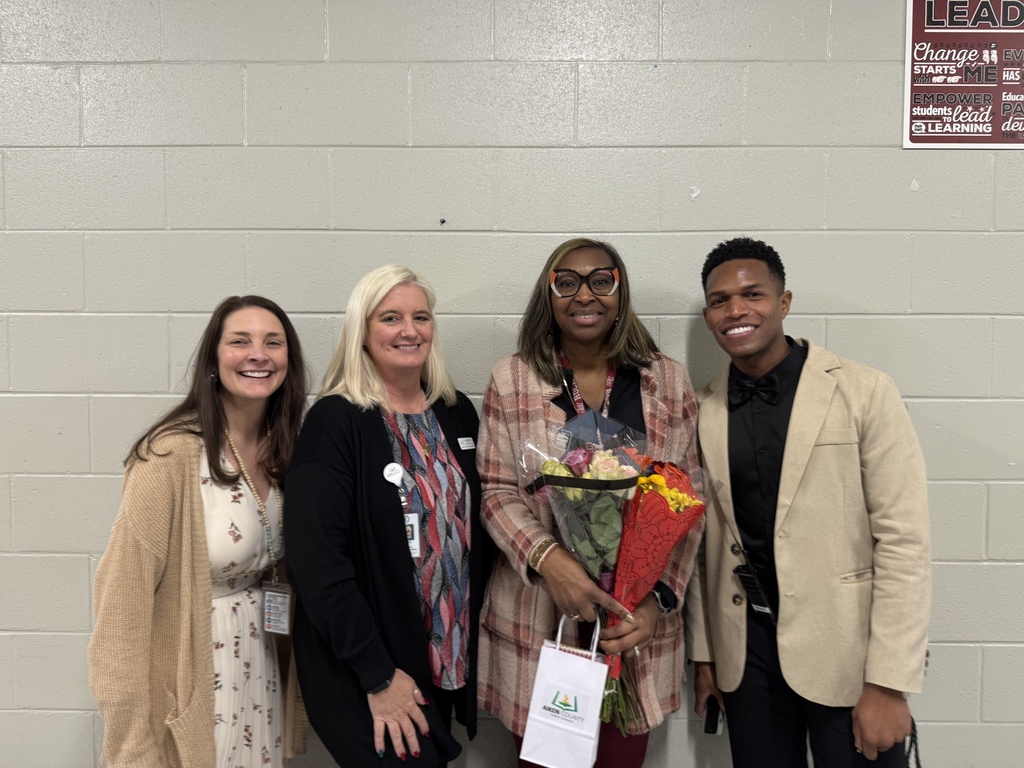 Leavelle McCampbell Middle's administrators pose with their Teacher of the Year Honor Court member.