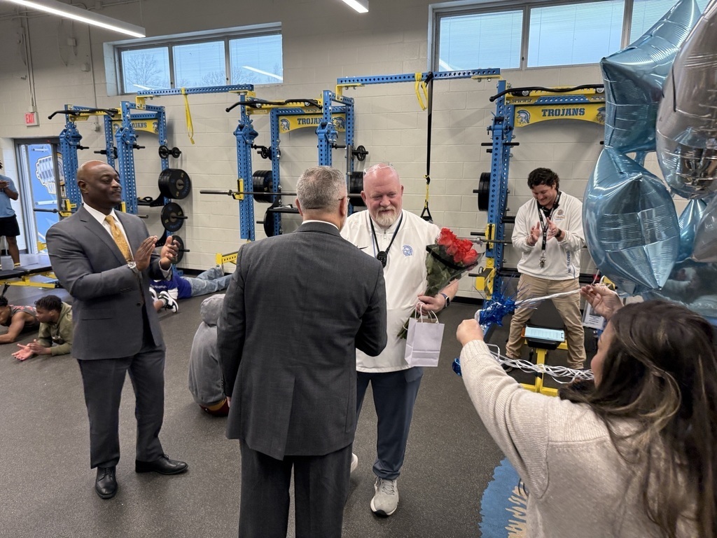 RSM Teacher of the Year Jerry Brannon is surprised in the weight room with flowers and balloons.