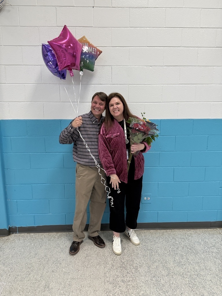 Megan Maxwell, right, poses with her husband after being named to the Teacher of the Year Honor Court.