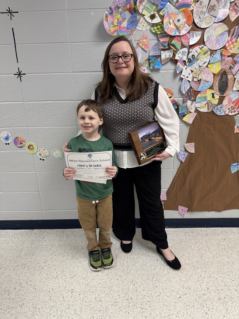 Mrs. Brooks and Henry being recognized as amazing Mavericks!