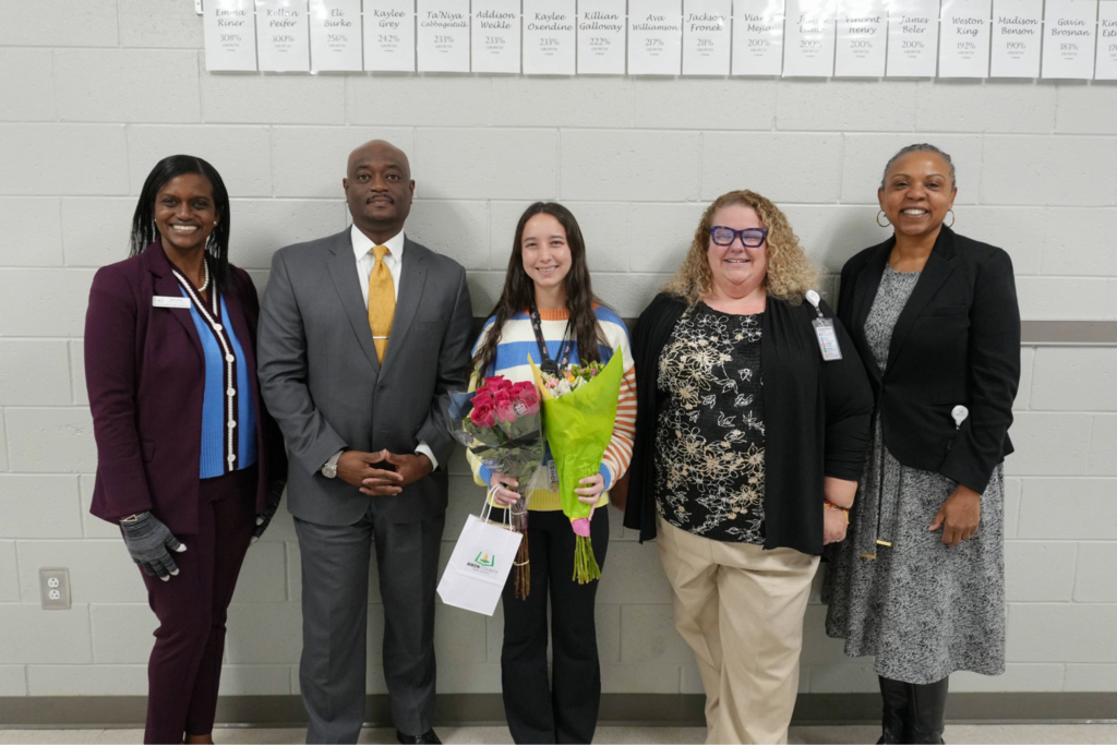 District leadership posing with First Year Techer of the Year honoree.