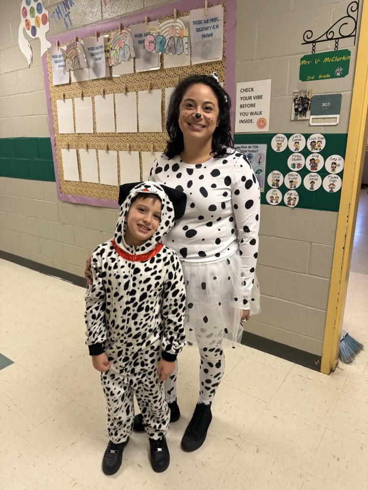 dressed as Dalmatians with black and white spots