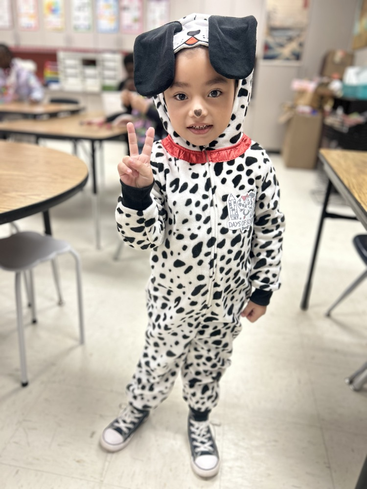 dressed as Dalmatians with black and white spots