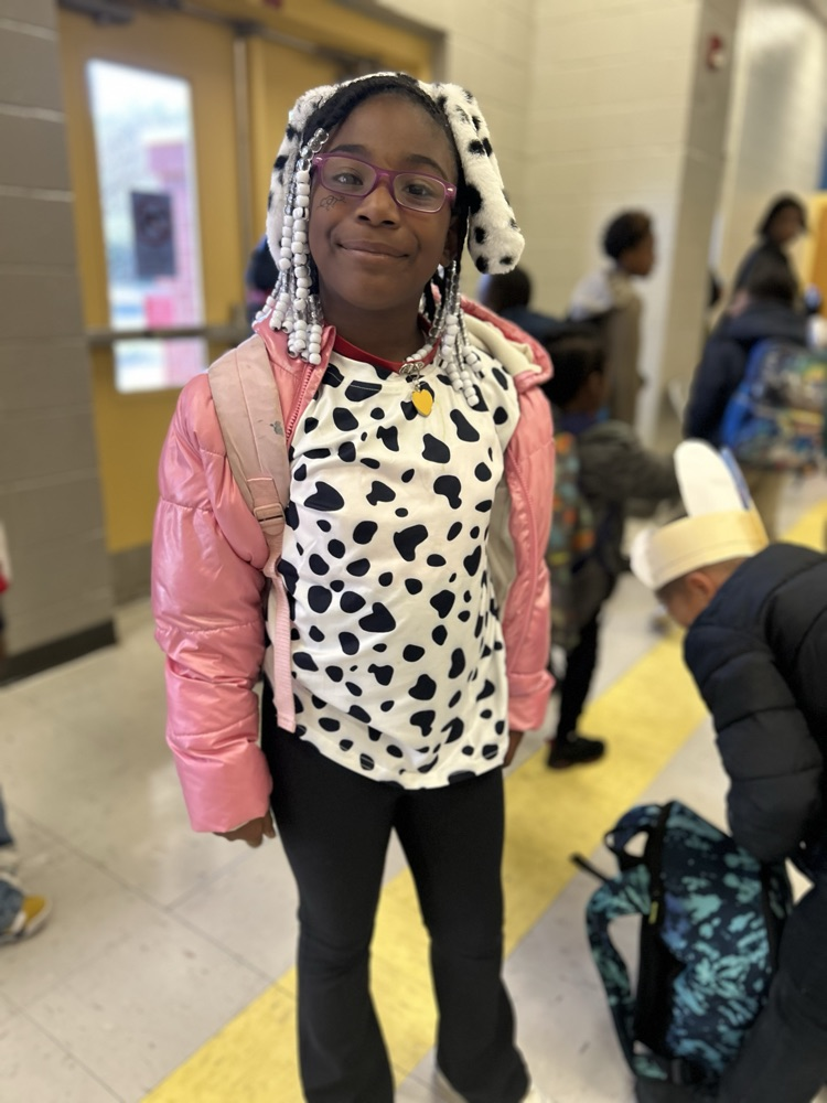 dressed as Dalmatians with black and white spots