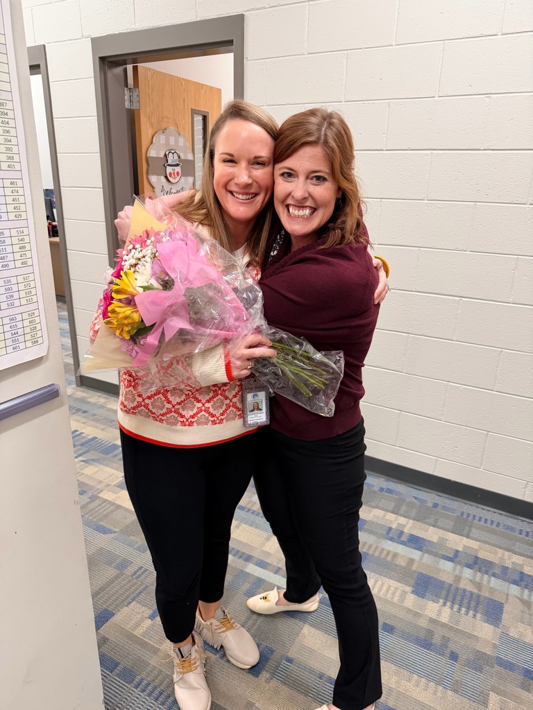 Two women hug as celebration.