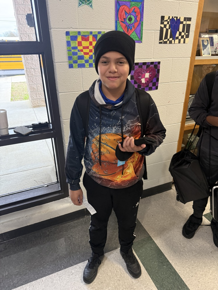 students posing for a picture wearing a beanie 